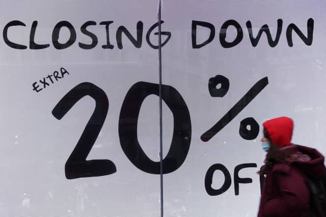 File photo of a closing down sign in a shop window (Photo by HOLLIE ADAMS/AFP via Getty Images)