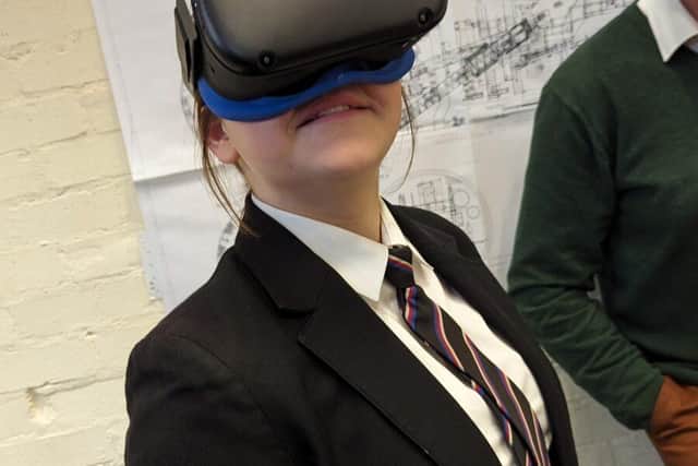 Student having fun using a VR headset