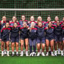Tricia is pictured second from right on the back row