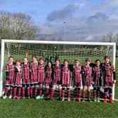 The Woburn and Wavendon FC show off their new kits donated by Dandara.