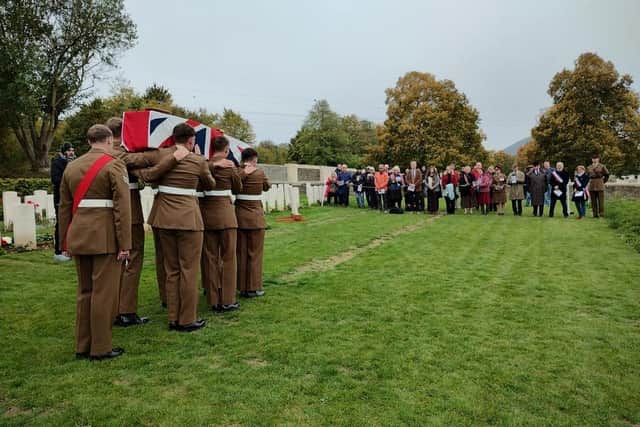 The coffin of Pte McIntosh is carried to the graveside as his family looks on (Crown Copyright)