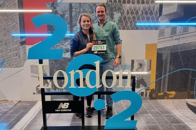 Fenella with husband, Ed, at the marathon expo collecting a race pack for the 2022 event.