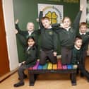 Children from Greenleas Lower School with a donated bench