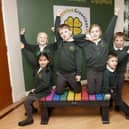 Children from Greenleas Lower School with a donated bench