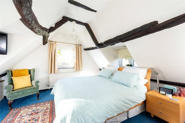 The principal bedroom is accessed via a dressing room and has a range of eaves storage cupboards and triple aspect windows with views over countryside and paddocks