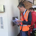Andrew Selous MP helping out on the rounds in Leighton Buzzard