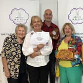 Members of Woburn in Bloom celebrated after receiving the Gold and Best Large Village Award