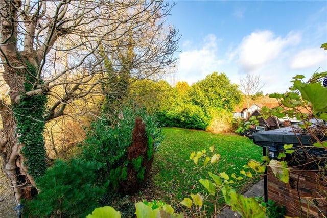 The rear garden is partially enclosed by a stone wall with steps down to a lawned garden. There are two paved terraces for al fresco entertaining. The terraces overlook the mill pond and are linked by a bridge with a view of the water wheel
