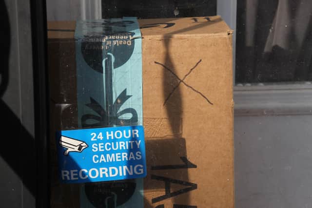 A decoy package, marked with an X, to discourage the so-called "porch pirates". Picture: SEBASTIEN DUVAL/AFP via Getty Images)