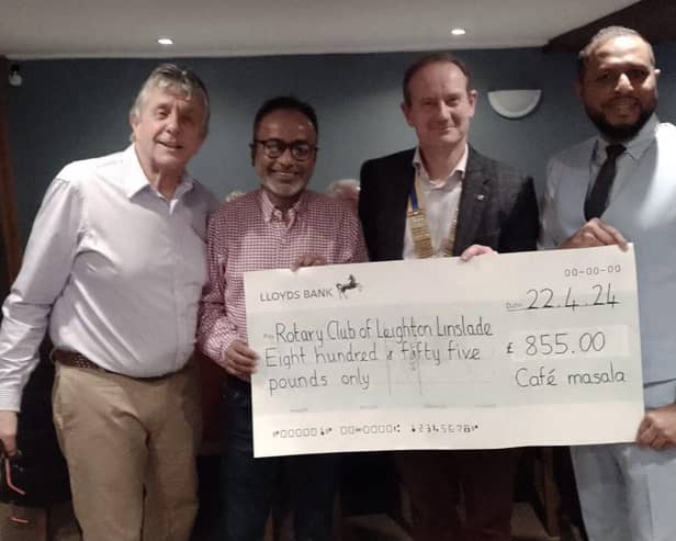 Rotary President Richard,Rotarian Giles and the Cafe Masala team with a fantastic cheque