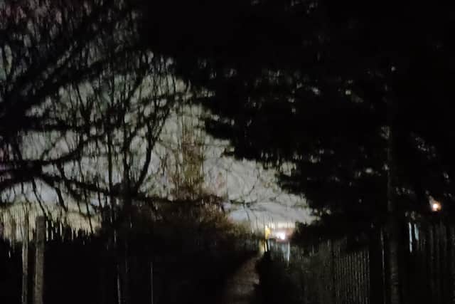 The footpath between Parsons Close Park and Grovebury Road is dark and dangerous without street lighting