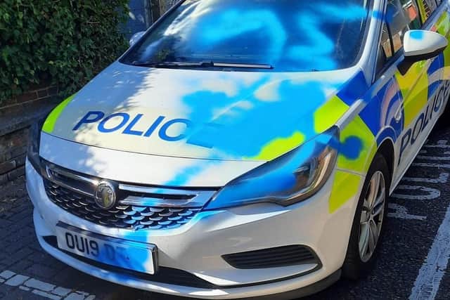 Graffiti covered this car's number plate, headlight and front window making it unsafe to drive. Image: Bedfordshire Police.