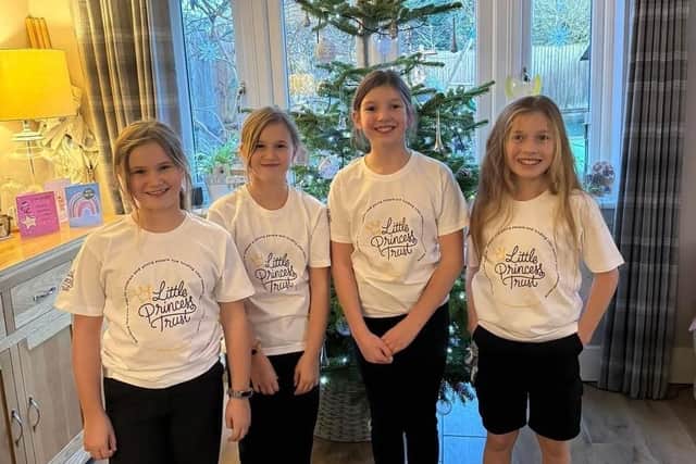 Ted (right) with his best friends Jessica, Jasmine and Izzy who held a cake sale at Wingate Methodist Church. They raised £640 to add to the money Ted had already raised by growing his hair for the Little Princess Trust. Picture: Lisa Kirby