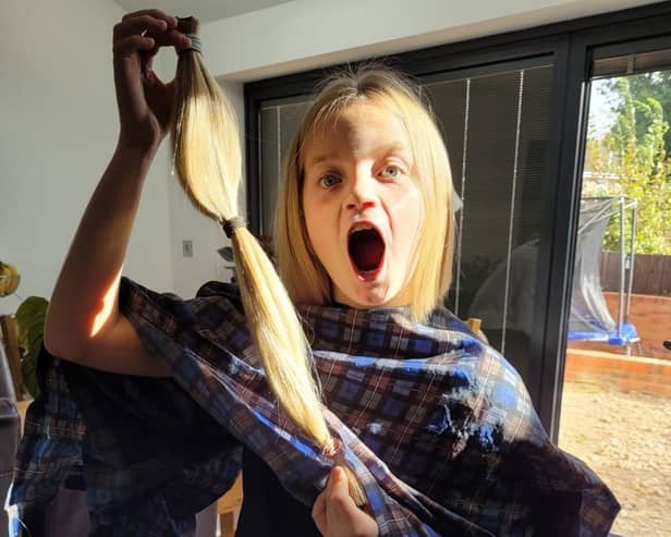 Blythe shows off the 19 inches of hair donated to the charity