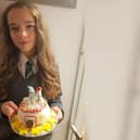 Remi-Ann Paice with the Christmas cake she's auctioning for Keech Hospice Care. She wants to be just like her late father Richard who raised lots of money for Keech when he was Morning Crew presenter 'Rentie' on Chiltern FM. Pic supplied by Sasha Paice