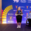 Eden Hays is pictured on stage with her award.