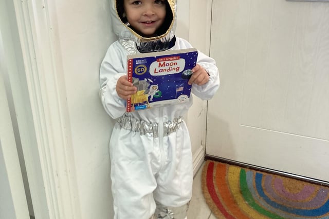 Mason, age 3, is dressed as an astronaut from his favourite non fiction book - Moon Landing