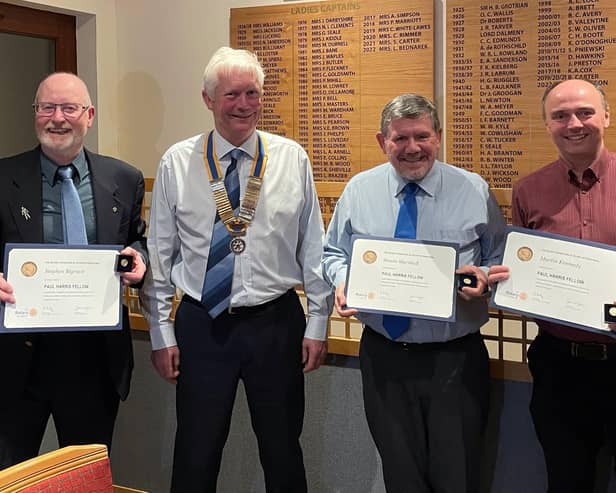 Awards presentation. From left to right: Rotarians Stephen, Robin, Simon, and Martin.