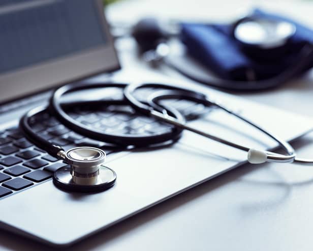 Stethoscope on laptop keyboard in doctor surgery with blood pressure monitor. PIC: Brian Jackson - stock.adobe.com