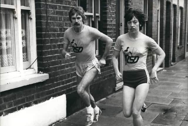 Ian Thompson running in Luton accompanied by wife Margaret. (Image: Keystone Press, Alamy Stock Photo)