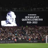 The LED board shows a photo Queen Elizabeth II as players of West Ham United and FCSB observe a minutes silence after it was announced that Queen Elizabeth II has passed away during the UEFA Europa Conference League group B match between West Ham United and FCSB at London Stadium on September 08, 2022 in London, England. (Photo by Richard Heathcote/Getty Images)