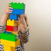 Child playing with building blocks. Picture: Dominic Lipinski/PA Wire