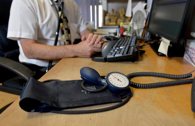 Image of a GP at their desk. Picture: Anthony Devlin