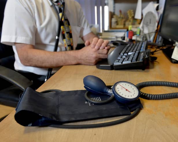 Image of a GP at their desk. Picture: Anthony Devlin