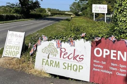 Pecks Farm Shop had to erect their own signs to indicate it was business as usual during the road closures