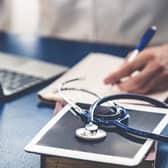 File photo of a doctor working in an office.