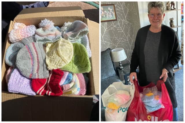 L: A box of the knitted hats and R: Di with her latest batch of 165 Hats for Ukraine Babies