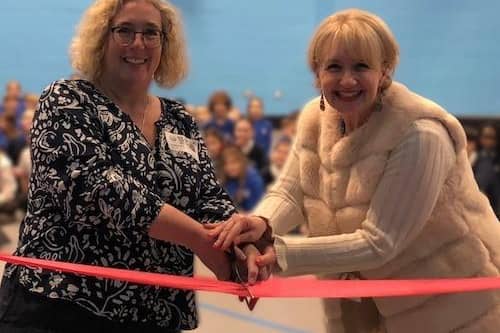 Cllr Hayley Whitaker (left) and Fulbrook School headteacher Sam Clancy cut the ribbon to officially open the brand-new sports hall. Image: Central Bedfordshire Council