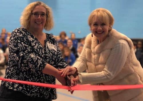 Cllr Hayley Whitaker (left) and Fulbrook School headteacher Sam Clancy cut the ribbon to officially open the brand-new sports hall. Image: Central Bedfordshire Council