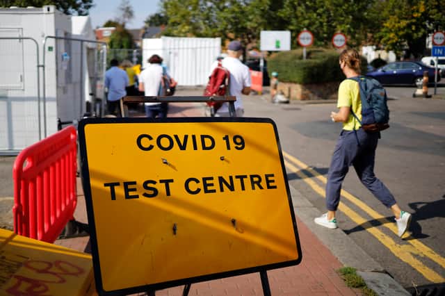 The government are cutting back on Coronavirus  advertisements to try and slow the demand for test 

(Photo by TOLGA AKMEN/AFP via Getty Images)