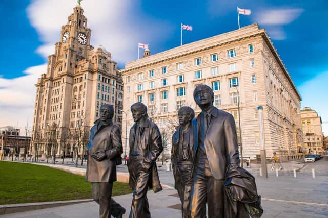 A bronze statue of the four Beatles stands on Liverpool Waterfront (Photo: Shutterstock)