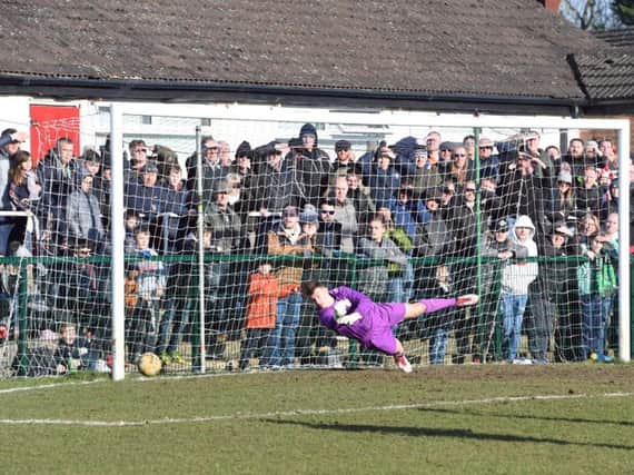 Tom Wyant can't keep out Scott McGowan's penalty