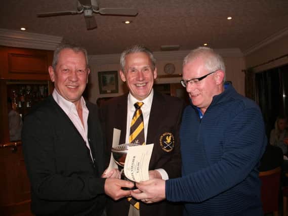 David Hawkins (left) and Paul Atkinson (right) are presented with the Dennis Jordan trophy by Leighton club Captain Jeremy Taylor.
