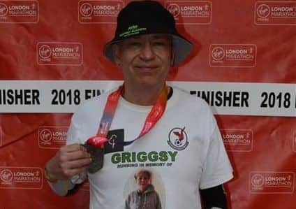 Andy with his medal after completing the London Marathon