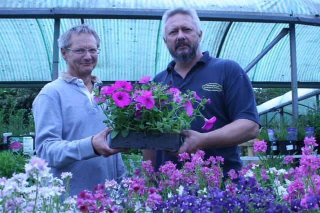 Site owners Martin and Stuart Hammond at the garden centre which will now be run by Ken Chen