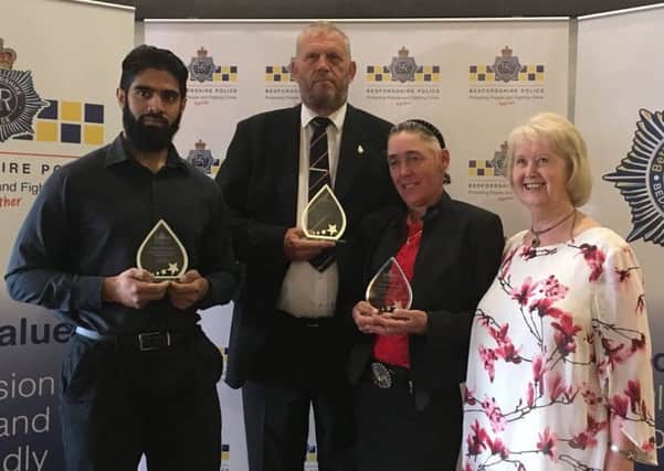 Winners of the Above and Beyond Award, from left to right,  Keleel Baksh, John Laidlaw, Janice Heath and Colleen Atkins MBE (who presented the award)