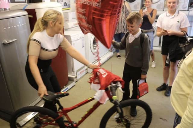 George Challis receives his bike and other gifts