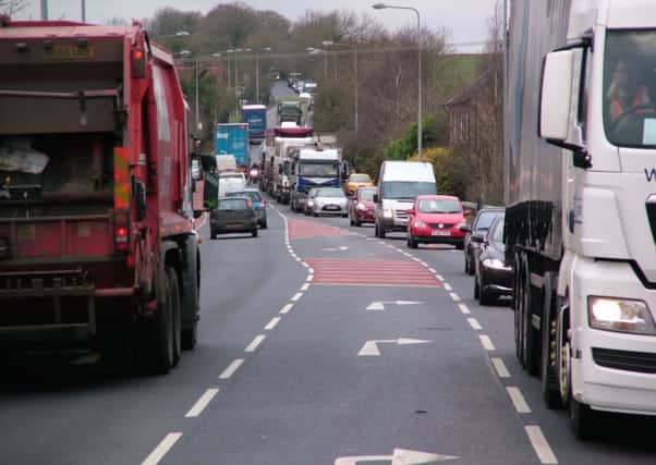 Traffic on the A5 through Hockliffe