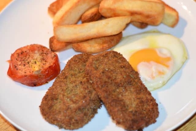 Spicy spam fritters with chips and egg.