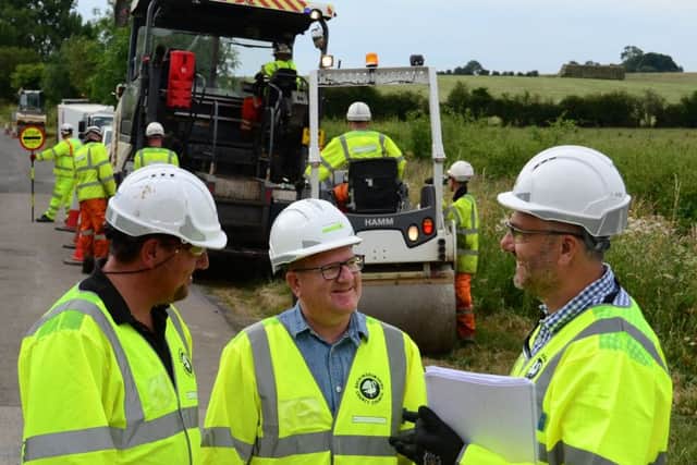 Mark Shaw meets Eurovia Surfacing supervisor Martin Graves (L) and TfB's Kevin Allen (R) with one of the surfacing crews who will work on Stoke Hammond bypass PNL-180722-232719001