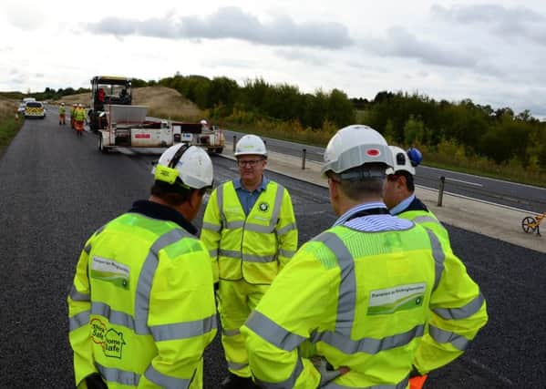 Mark Shaw, roadside briefing from contractors, Stoke Hammond bypass Photo by Buckinghamshire County Council.