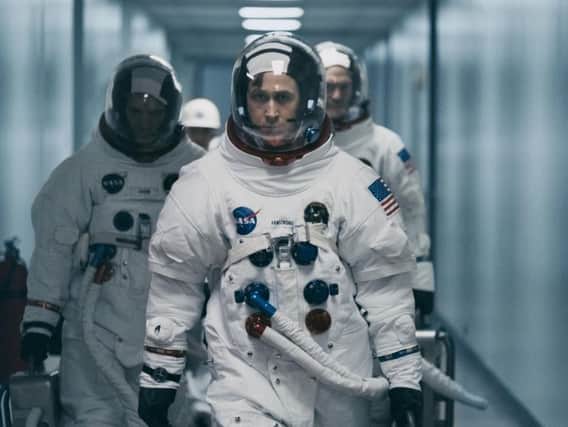 Lukas Haas as Michael Collins, Ryan Gosling as Neil Armstrong and Corey Stoll as Buzz Aldrin