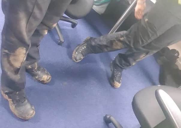 The officers' muddy legs after tracking down one of the teen offenders who threw the fireworks. Credit: Bedfordshire Police.