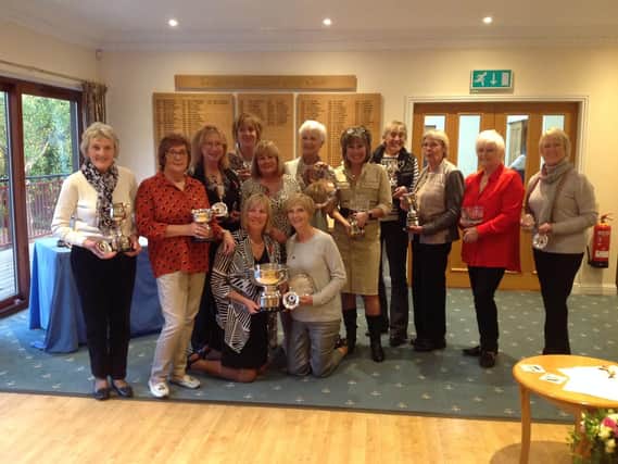 Beryl Wood (Senior Ladies Handicap Cup); Gill McDougall (Croxford Cup); Val Berry (Lucking Cup and Bridgestone Medal); Lesley Brazier (Lady of the Year); Ladies Captain Carmen White Lawes; Alison Shirville (Grannies Salver); Farida Cerosio (Summer Eclectic Bowl, Cherie James Birdies award); Lesley Bednarek (Senior Ladies championship, Challenge Cup and Foursomes Cup ); Elaine Powell (Foursomes Cup); Joyce Young (Winter Eclectic); Janice Hintner (nine hole Merit Award); Front kneeling: Outgoing Captain Patti Marriott and Vicky Pratt who won the Buckmaster Salver.