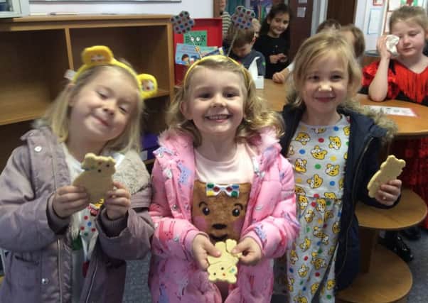 Heathwood pupils enjoying the yummy Pudsey biscuits