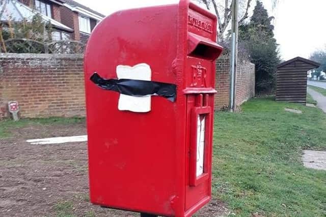 Bread stapled to the post box in Stewkley